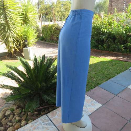 High waisted boutique made cobalt blue pencil skirt size 40/16. Elastic in side waist.Back zip/slit.