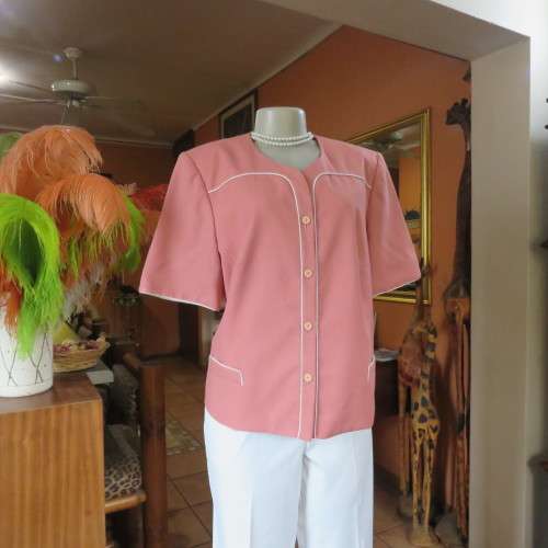 Smart hip length apricot colour short sleeve lined jacket with cream cord edging.Size 42 by MATSON