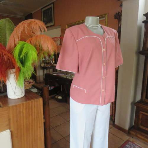 Smart hip length apricot colour short sleeve lined jacket with cream cord edging.Size 42 by MATSON