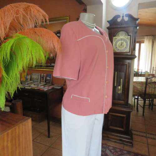 Smart hip length apricot colour short sleeve lined jacket with cream cord edging.Size 42 by MATSON