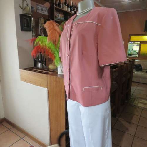 Smart hip length apricot colour short sleeve lined jacket with cream cord edging.Size 42 by MATSON