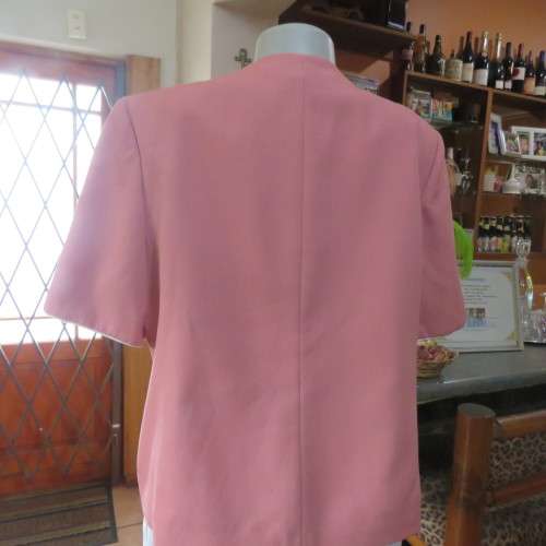 Smart hip length apricot colour short sleeve lined jacket with cream cord edging.Size 42 by MATSON