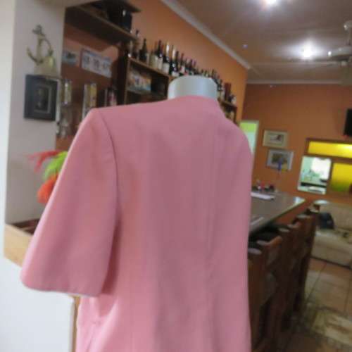 Smart hip length apricot colour short sleeve lined jacket with cream cord edging.Size 42 by MATSON