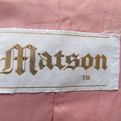 Smart hip length apricot colour short sleeve lined jacket with cream cord edging.Size 42 by MATSON