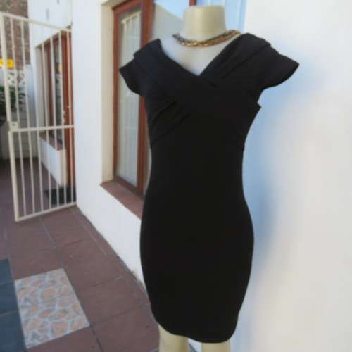 Stunning black stretch ribbed polyester dress.Capped sleeves.V with cross over detail.Size 32 AMERIE