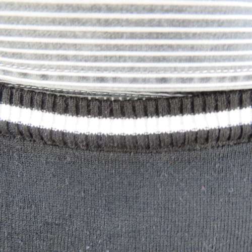 Men`s black acrylic knit pullover. Diamond pattern.White edging.Striped attached sleeved/collar.Med