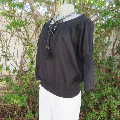 Pretty peasant style black 100% cotton top. Elasticated neckline and hemline. Size 40/16.WOOLWORTHS