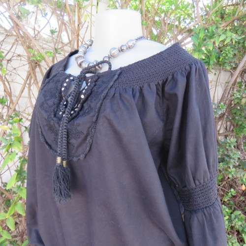 Pretty peasant style black 100% cotton top. Elasticated neckline and hemline. Size 40/16.WOOLWORTHS