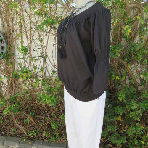Pretty peasant style black 100% cotton top. Elasticated neckline and hemline. Size 40/16.WOOLWORTHS