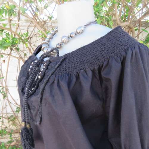 Pretty peasant style black 100% cotton top. Elasticated neckline and hemline. Size 40/16.WOOLWORTHS