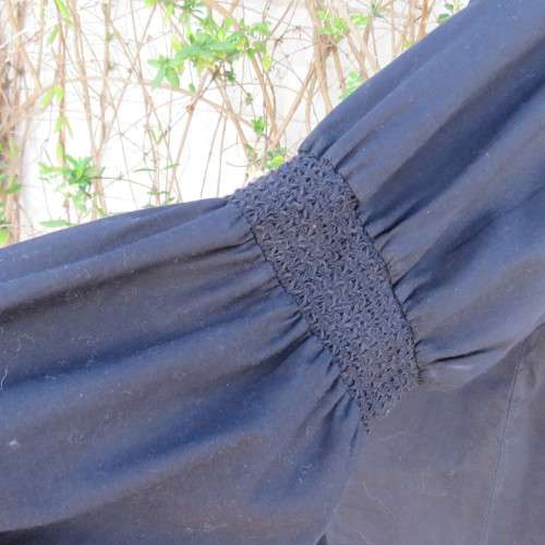 Pretty peasant style black 100% cotton top. Elasticated neckline and hemline. Size 40/16.WOOLWORTHS