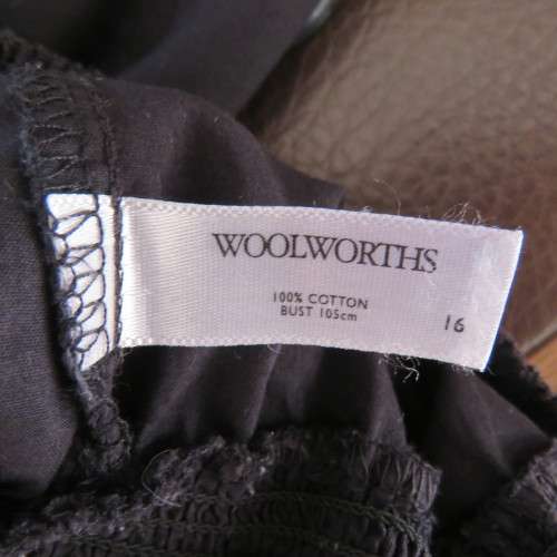 Pretty peasant style black 100% cotton top. Elasticated neckline and hemline. Size 40/16.WOOLWORTHS