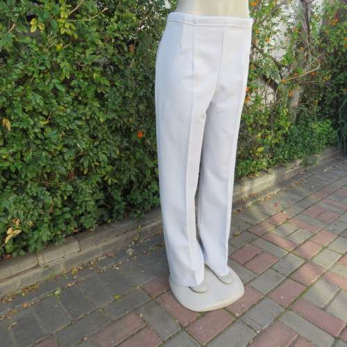 Powder blue, as new, crimplene dress pants. Amazing quality. Size 36 to 38. slightly bootlegged,
