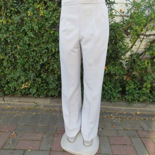 Powder blue, as new, crimplene dress pants. Amazing quality. Size 36 to 38. slightly bootlegged,