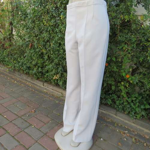 Powder blue, as new, crimplene dress pants. Amazing quality. Size 36 to 38. slightly bootlegged,