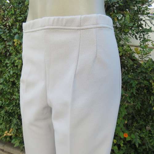 Powder blue, as new, crimplene dress pants. Amazing quality. Size 36 to 38. slightly bootlegged,