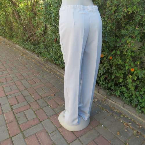 Powder blue, as new, crimplene dress pants. Amazing quality. Size 36 to 38. slightly bootlegged,