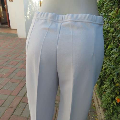 Powder blue, as new, crimplene dress pants. Amazing quality. Size 36 to 38. slightly bootlegged,