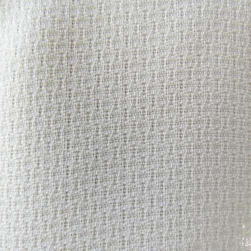 High quality long textured cream polyester top. Sleeveless. Exotic silver front embroidery. Size 36