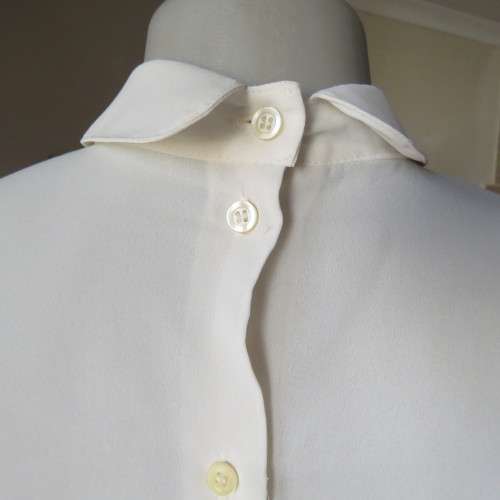 Romantic long sleeve cream polyester blouse from 80`s. Tucked seams front.Size 38/14. Very good cond