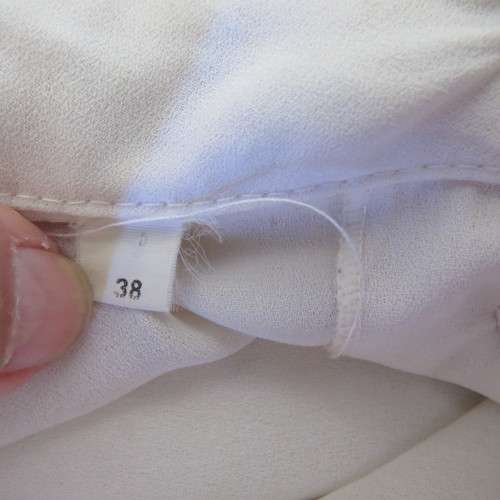 Romantic long sleeve cream polyester blouse from 80`s. Tucked seams front.Size 38/14. Very good cond