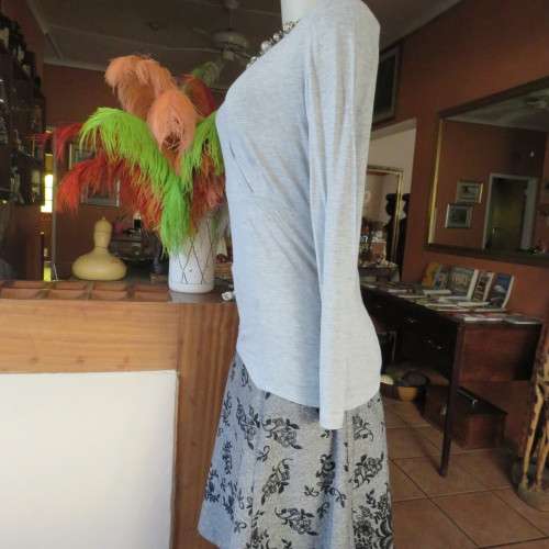 Silver grey long sleeve size 36/12 empire waist top with fold over bust. By JFK. Stretch viscose.