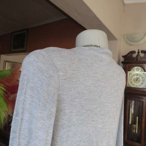 Silver grey long sleeve size 36/12 empire waist top with fold over bust. By JFK. Stretch viscose.