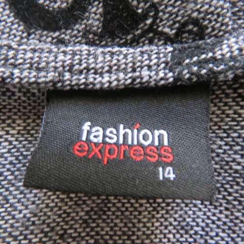 Well cut bandless paneled skirt in mottled grey with velvet floral patterns.Size 38/14.New condition
