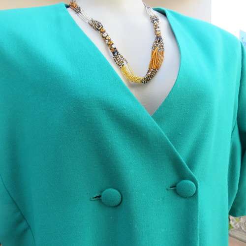 Smart double breast jade colour short sleeve boutique made V front jacket. Size 42/18. New cond.
