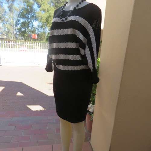 Unique black acrylic/cotton knitted kimono sleeve top with cream stripes. Scooped neckline.Size 36