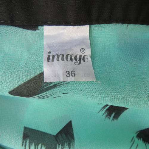 Cool sleeveless sheer turquoise poly top with black brush marks/collar/hidden button down.Size 36/12