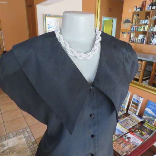 Lovely black silky polyester button down top. Tiny cut-on sleeves. Wide pointed collar. Size 40/16.