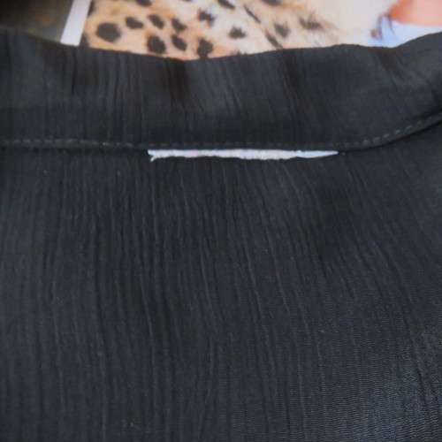 Lovely black silky polyester button down top. Tiny cut-on sleeves. Wide pointed collar. Size 40/16.