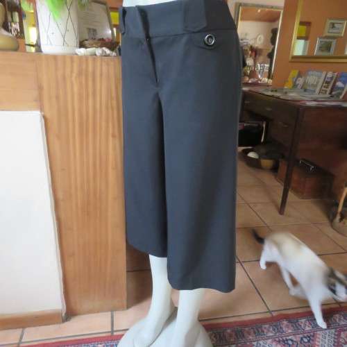 As new black stretch polyester culotte pants size 36/12 by CONNECTION. Dummy pockets. Belt loops