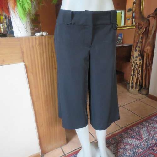 As new black stretch polyester culotte pants size 36/12 by CONNECTION. Dummy pockets. Belt loops