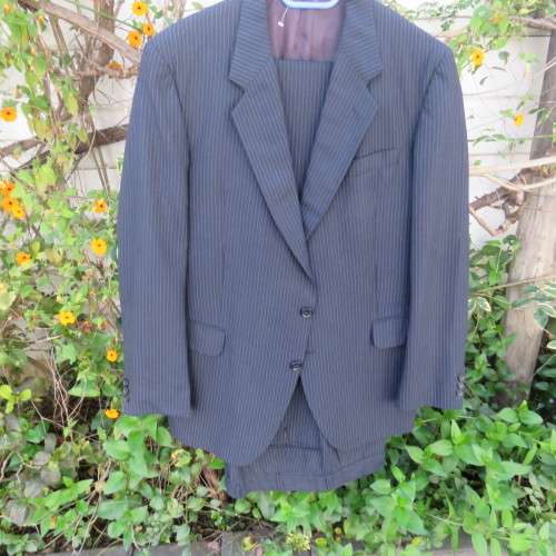 Men`s very dark navy/thin grey stripes 2 pc trevira with 45% new wool suit. Jacket 42R. Pants 40.