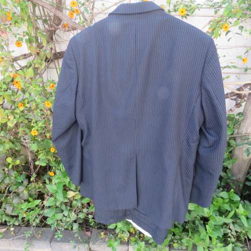 Men`s very dark navy/thin grey stripes 2 pc trevira with 45% new wool suit. Jacket 42R. Pants 40.