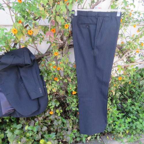 Men`s very dark navy/thin grey stripes 2 pc trevira with 45% new wool suit. Jacket 42R. Pants 40.