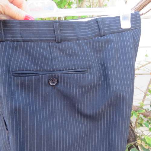 Men`s very dark navy/thin grey stripes 2 pc trevira with 45% new wool suit. Jacket 42R. Pants 40.