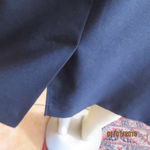 Elegant dark navy polyester pencil skirt. Upper calf length. Zip/pleat at back. Size 42 to 44.As new