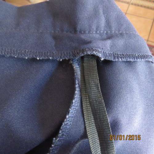 Elegant dark navy polyester pencil skirt. Upper calf length. Zip/pleat at back. Size 42 to 44.As new