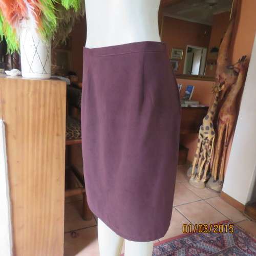 Elegant purple suede look pencil skirt just under knee length. Size 38/14. Zip at back. As new cond