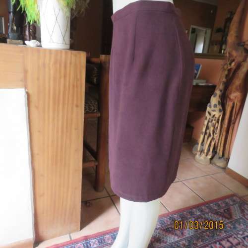 Elegant purple suede look pencil skirt just under knee length. Size 38/14. Zip at back. As new cond
