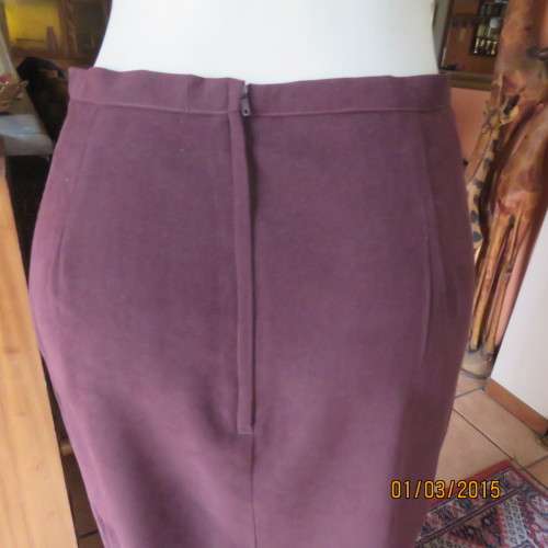Elegant purple suede look pencil skirt just under knee length. Size 38/14. Zip at back. As new cond