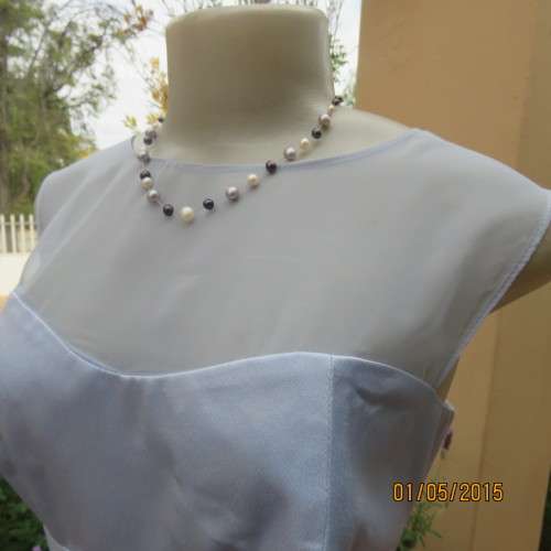 Beautiful long powder blue satin evening dress. With stunning back.Size 36. No label. As new cond.