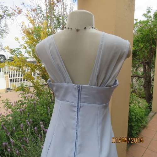 Beautiful long powder blue satin evening dress. With stunning back.Size 36. No label. As new cond.
