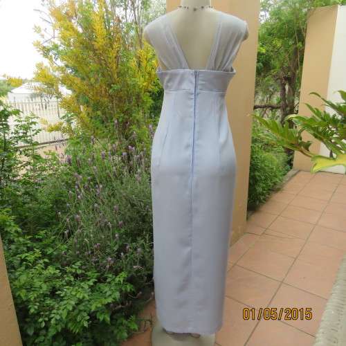 Beautiful long powder blue satin evening dress. With stunning back.Size 36. No label. As new cond.