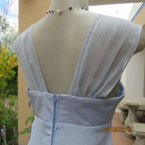 Beautiful long powder blue satin evening dress. With stunning back.Size 36. No label. As new cond.