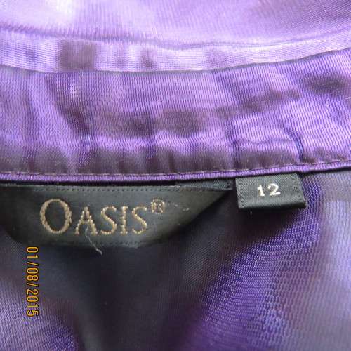 Glamorous shiny sheer purple long cuffed sleeve top.Tailored. By OASIS in size 36/12. Brand new cond