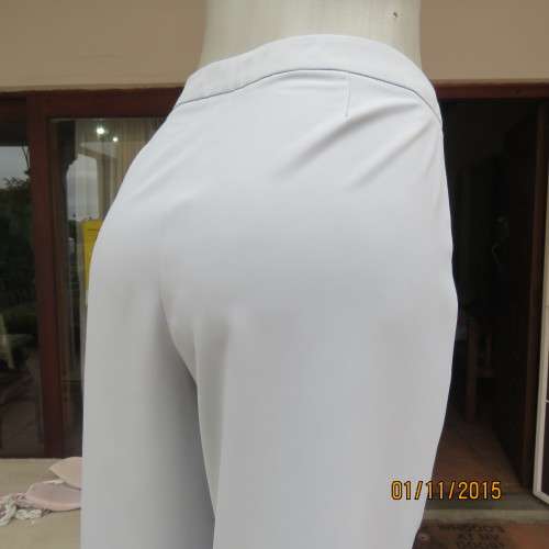 Stunning light grey ankle pants by DIJON with size 38/14 perfect fit. Bandless/front zip. New cond.